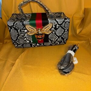 Elegant Snake Print Handbag with Gold Bee Accent